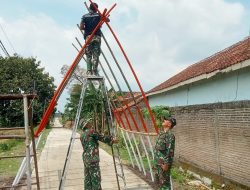 Warga dan TNI buat gapura masuk jalan cor